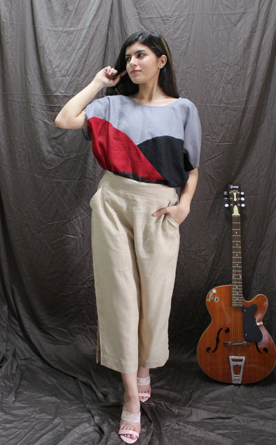 Beige Wide Leg Linen Culottes: woman in Ivory Beige linen culottes and colorblock top, hand near her ear