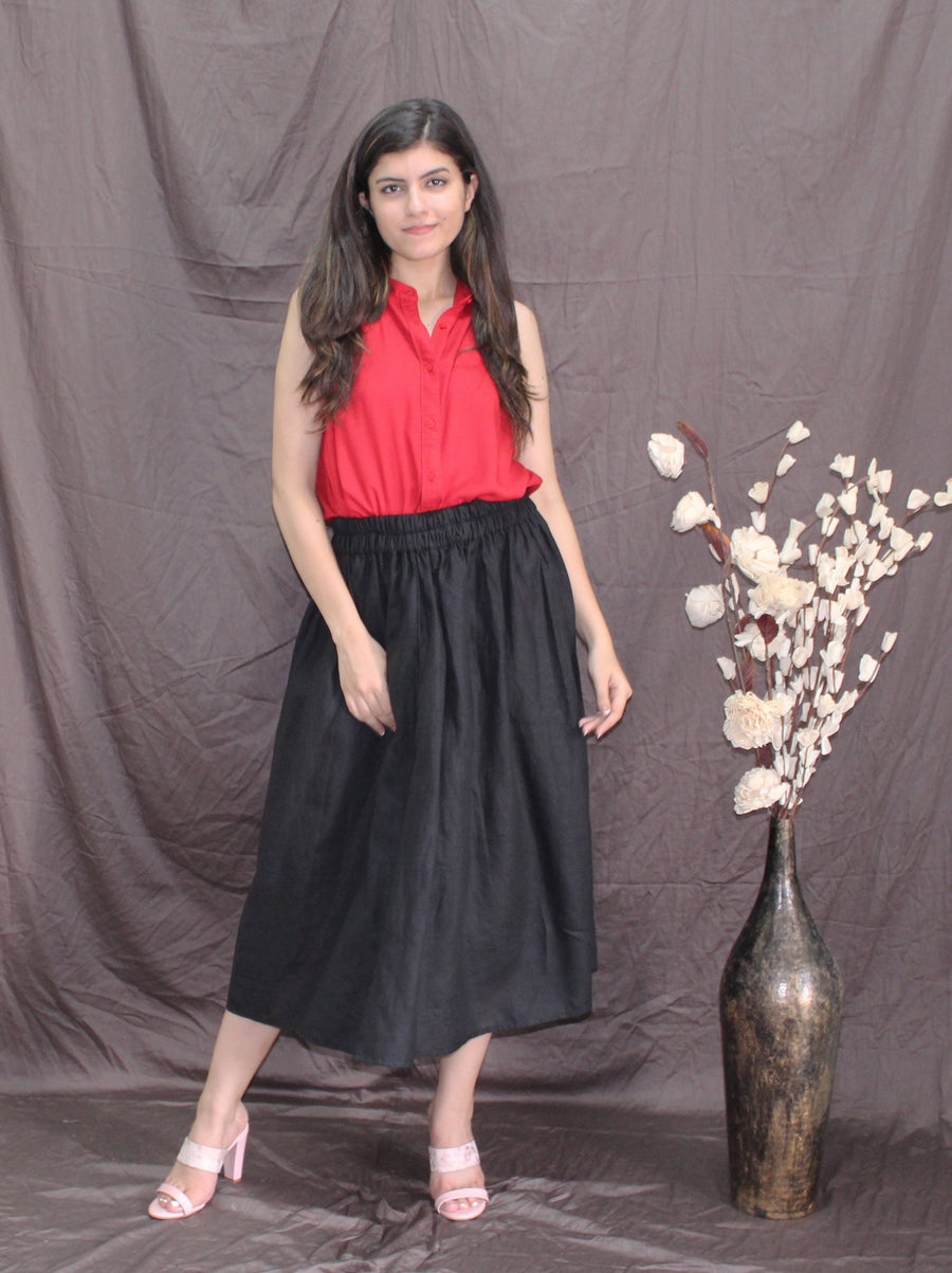 Black Linen Midi Skirt, Pleated Flared: woman in Black flared midi skirt and red top, full length