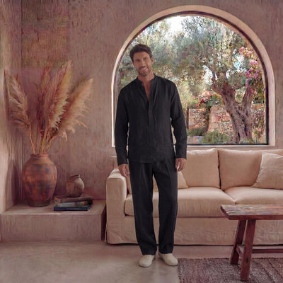 Men's Black Linen Shirt, Long Sleeve: man in black long sleeve linen shirt, standing with arms relaxed, arched window