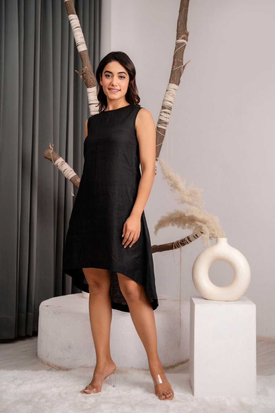Black Sleeveless Linen Tunic Dress, Boat Neck: woman in black boat neck linen tunic dress, standing near a vase, full length
