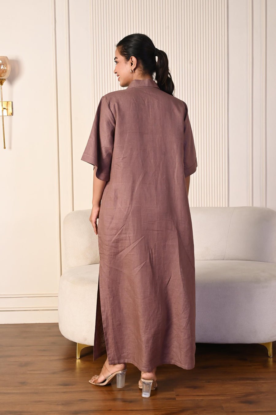 Brown Linen Collared Maxi Dress: back view of woman in mauve brown linen maxi dress with ponytail
