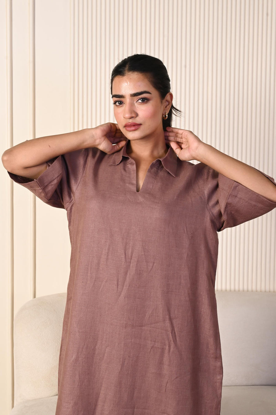 Brown Linen Collared Maxi Dress: close-up of mauve brown linen maxi dress with collar, hands at her neck
