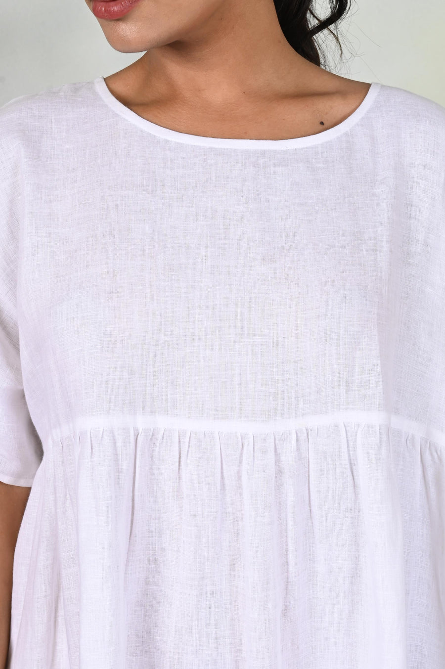 Handmade Linen Midi Dress, Empire Waist: close-up of White dress round neck and gathered seam