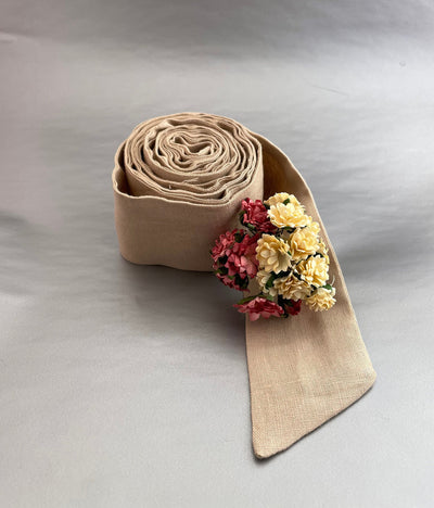 Handmade Washed Linen Belt: tan linen belt rolled with small flowers