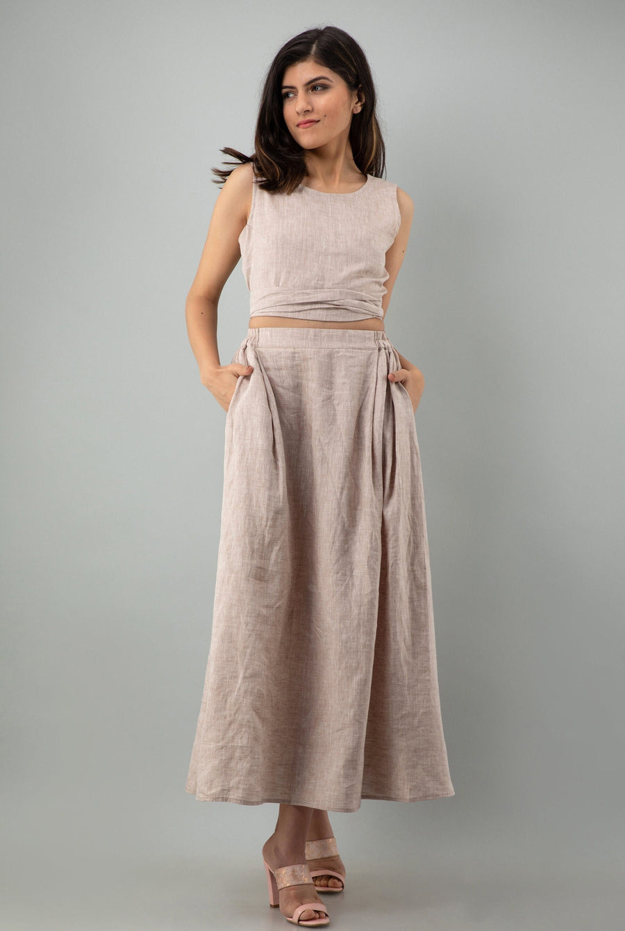 Linen Crop Top and Maxi Skirt Set: hands in pockets in Latte crop top and maxi skirt