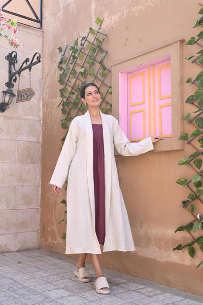 Linen Kimono Wrap Dress, Oversized: woman in Natural kimono wrap, full length, hand on wall