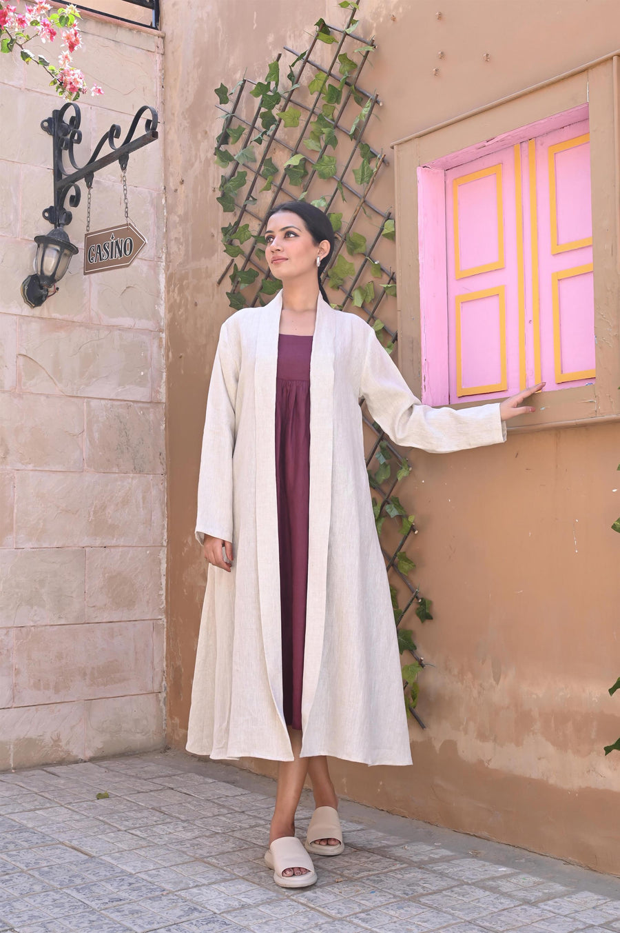 Linen Kimono Wrap Dress, Oversized: woman in Natural kimono wrap, hand on pink window frame