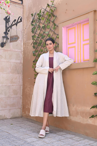Linen Kimono Wrap Dress: woman in Natural kimono wrap over plum dress