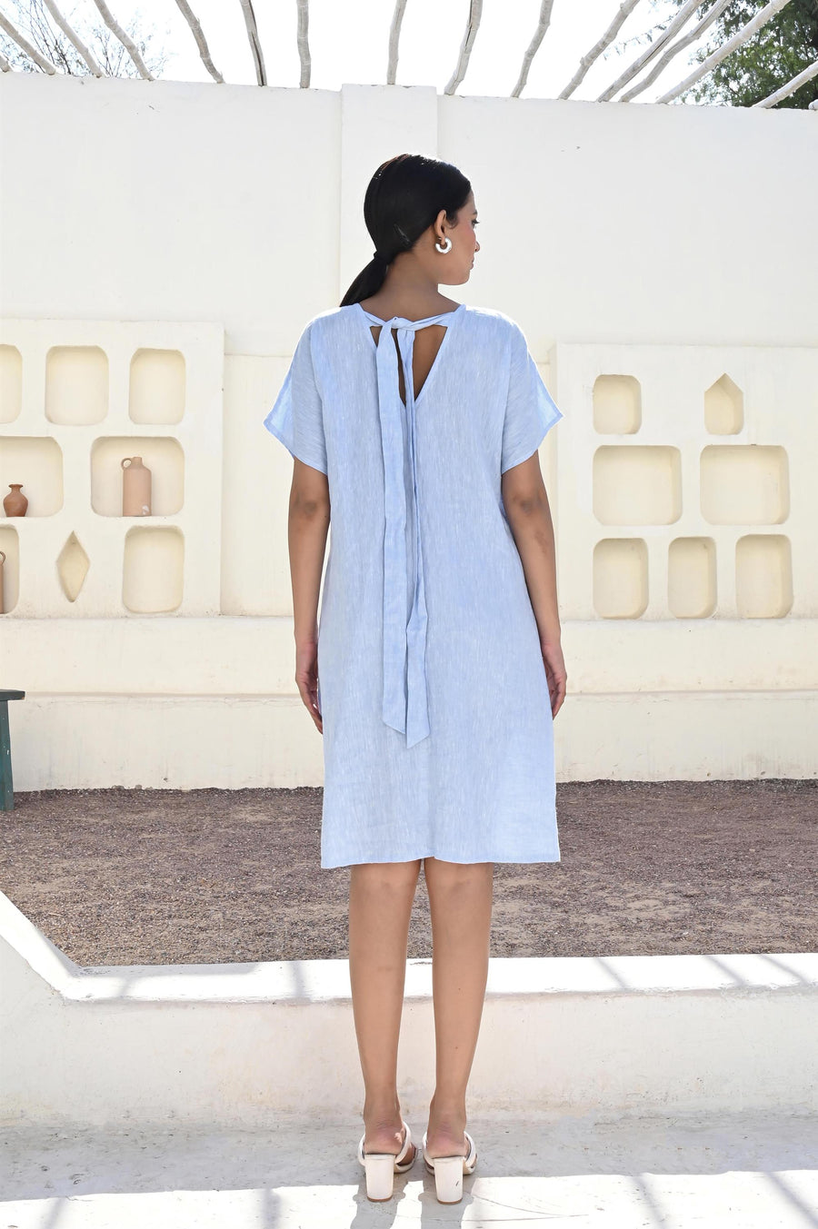 Linen Midi Dress with Bow Back Detail: back view of Ice Blue linen dress with bow tie detail at the back
