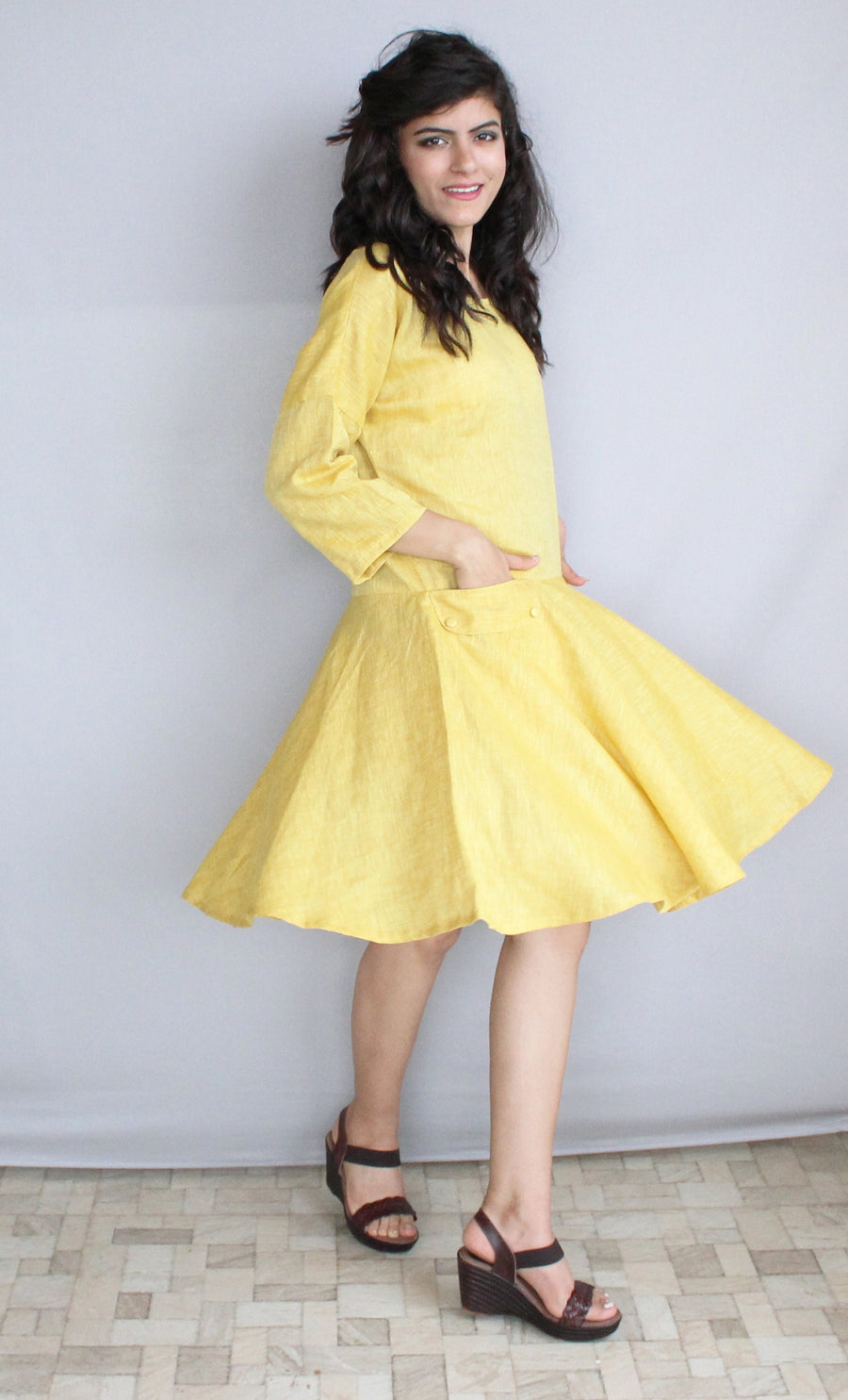 Linen Midi Shift Dress, Pockets: woman in yellow linen dress with flared skirt, hand in pocket, studio