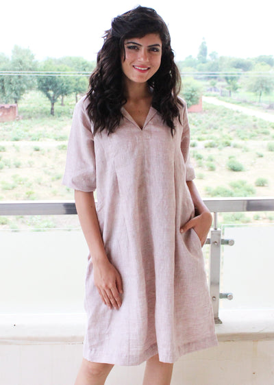 Linen Tunic Dress with Half Sleeves: three quarter view of blush linen tunic dress with front pleat and pockets