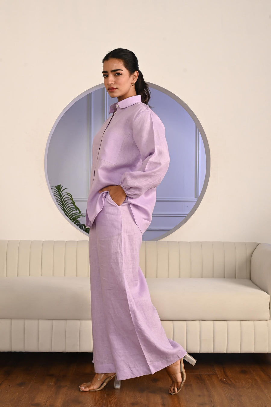 Linen Two-Piece Set, Shirt and Pants: side view of Lilac shirt and wide pants, hand in pocket