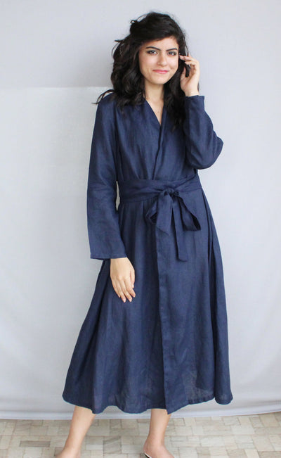 Linen Wrap Dress, Long Sleeve: woman in Navy Blue wrap dress, hand at ear, front view