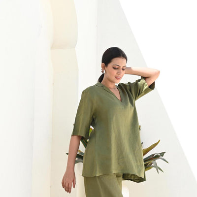 Long Linen Blouse, Half Sleeve Tunic: woman in Moss Green tunic, hand at hair, side view