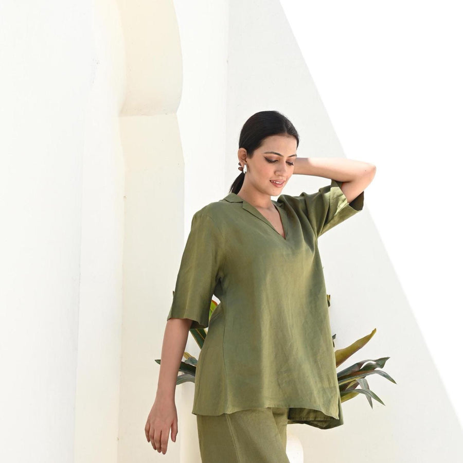 Long Linen Blouse, Half Sleeve Tunic: woman in Moss Green tunic, hand at hair, side view