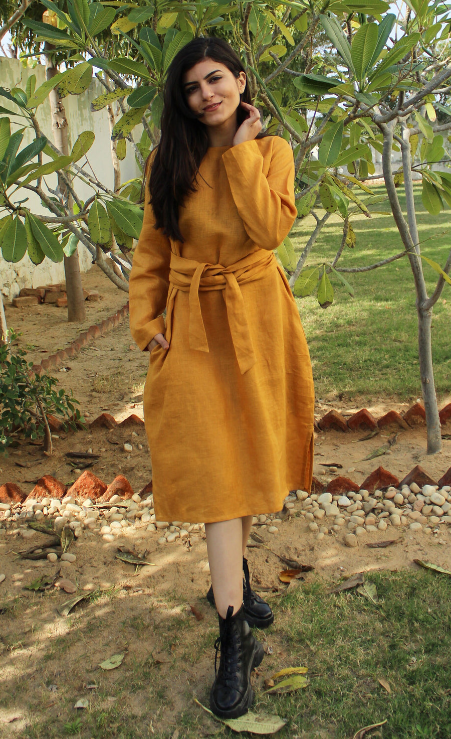 Long Sleeve Belted Linen Midi Dress: woman in Honey midi dress, standing in garden