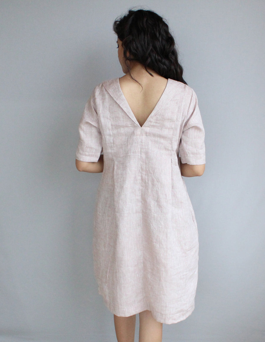 Loose Linen Midi Tunic Dress, Relaxed Fit: back view of pale blush linen tunic dress with V back