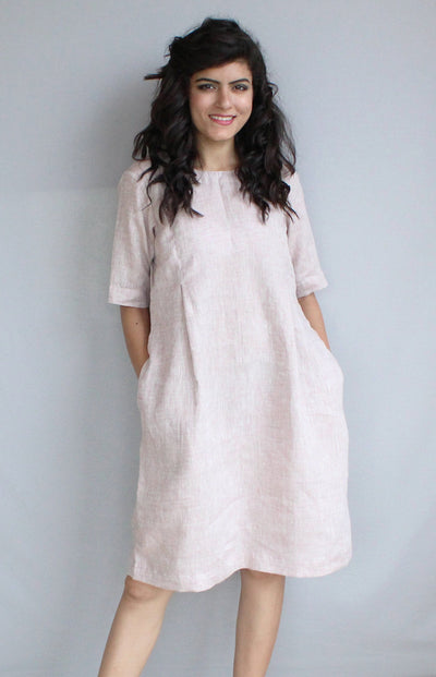 Loose Linen Midi Tunic Dress, Relaxed Fit: woman in pale blush loose linen midi tunic dress with pockets, front view