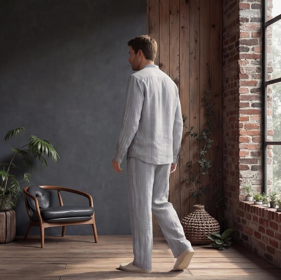 Men's Linen Button-Up Shirt: man in Light Grey linen shirt and trousers walking away, back view, loft room