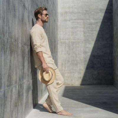 Men's Linen Notched V-Neck Shirt, Full Sleeve: man in Beige shirt and trousers, side profile, hat in hand