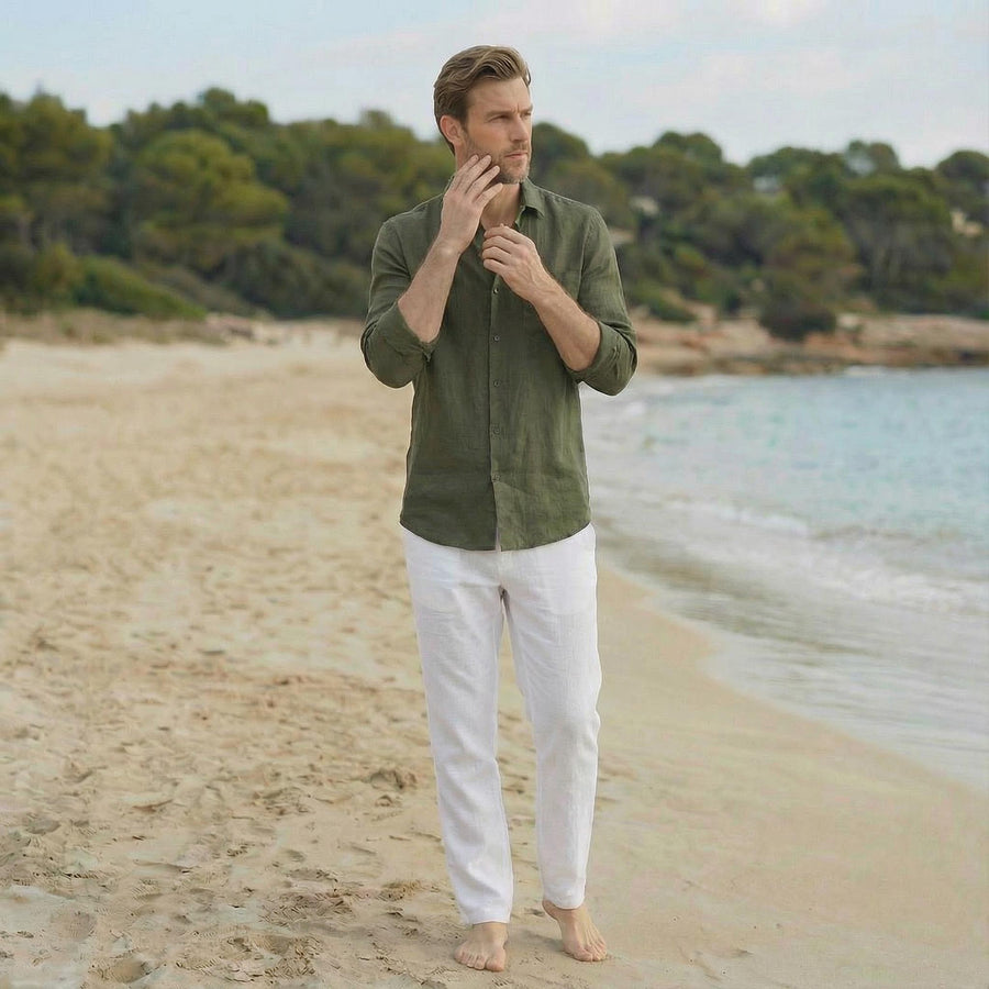 Men's Linen Shirt, Relaxed Fit: man in Moss Green linen shirt with hand at chin, white trousers