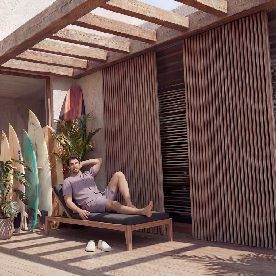 Men's Mandarin Collar Linen Shirt, Relaxed Fit: man reclining on a lounger in dusty mauve shirt and shorts