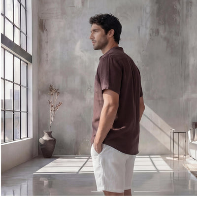 Men's Plus Size Short Sleeve Linen Shirt: side profile of man in brown short sleeve linen shirt and white shorts