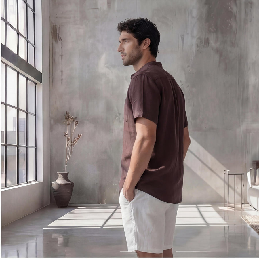 Men's Plus Size Short Sleeve Linen Shirt: side profile of man in brown short sleeve linen shirt and white shorts