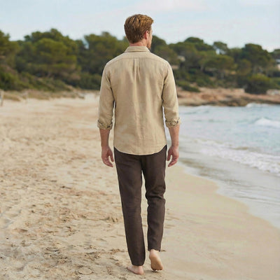 Men's Pure Linen Button-Up Shirt, Long Sleeve: back view of man in Natural long sleeve linen shirt and brown trousers