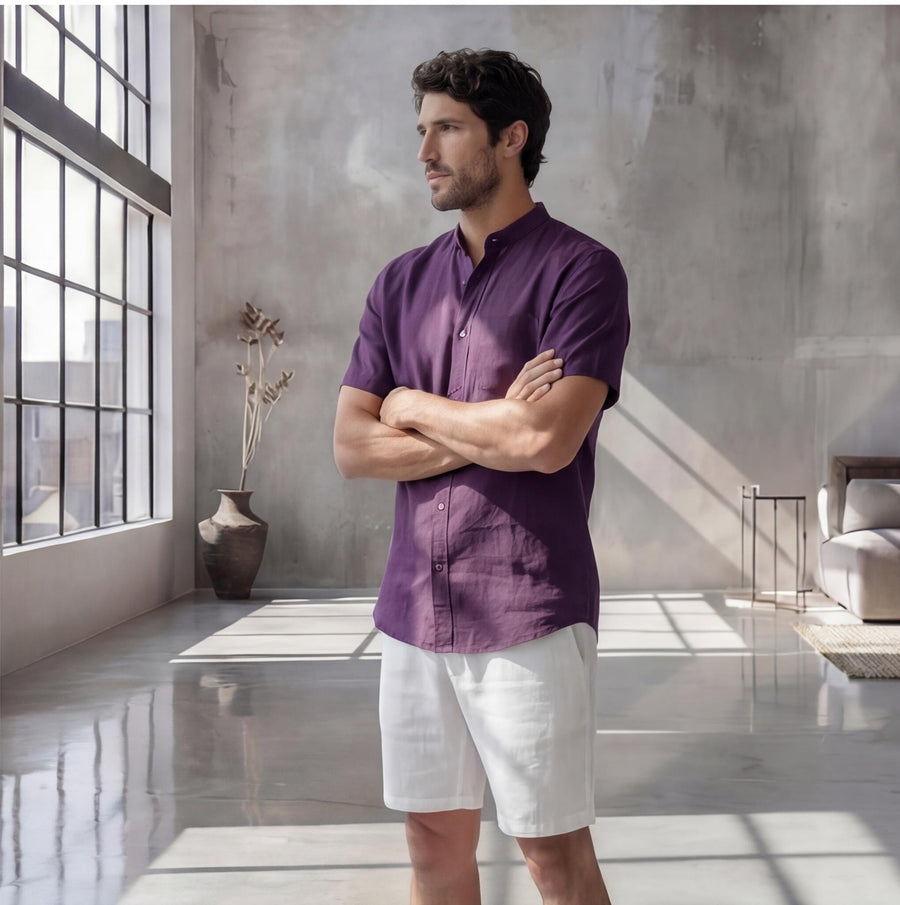Men's Short Sleeve Linen Shirt, Solid Color: man in Dark Plum shirt, arms crossed by window