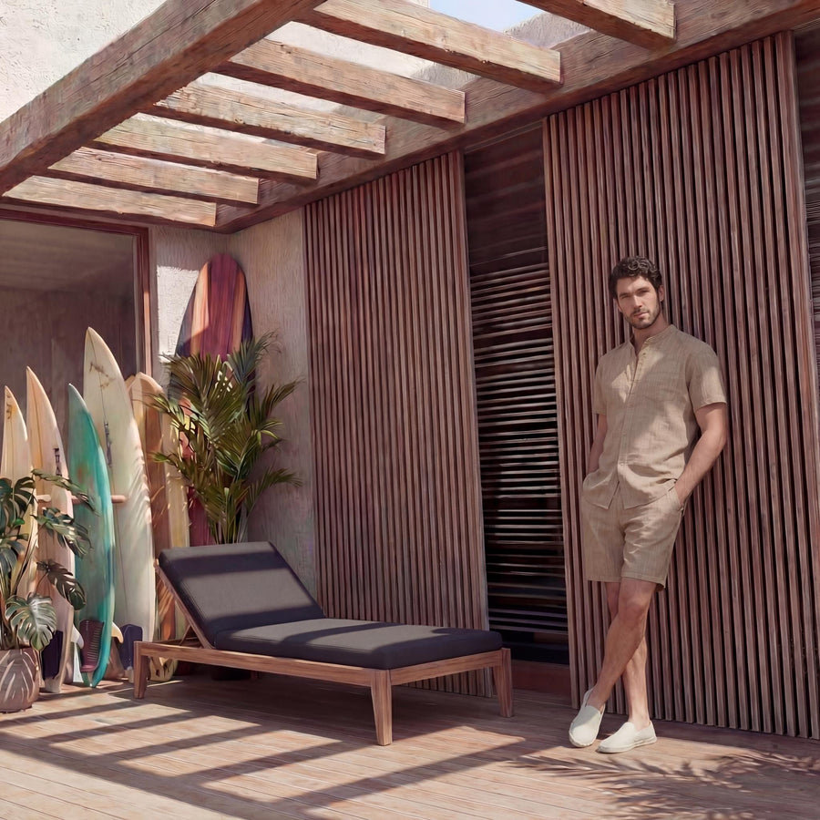 Men's Softened Short Sleeve Linen Shirt: man leaning at the right edge of the frame in beige linen shirt and shorts