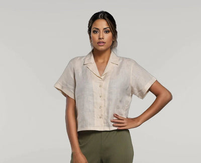 Off White Linen Shirt, Button Up: woman in Off White linen camp collar shirt and olive trousers, hands on hips