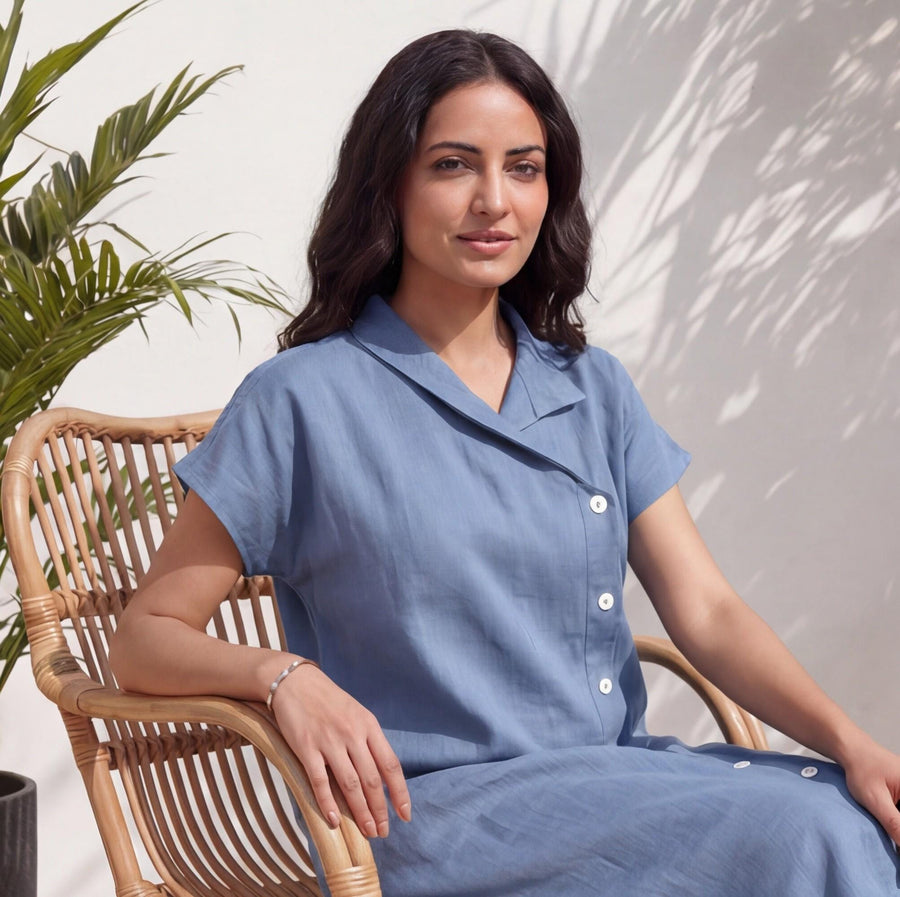 Oversized Linen Tunic Dress, Short Sleeve: close view of woman in Blue oversized linen tunic dress seated on a rattan chair
