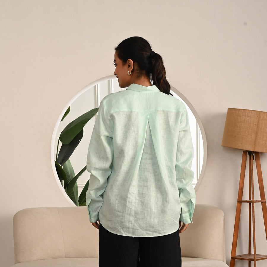 Oversized Pure Linen Button-Up Shirt: back view of Mint Mist oversized linen shirt and black trousers
