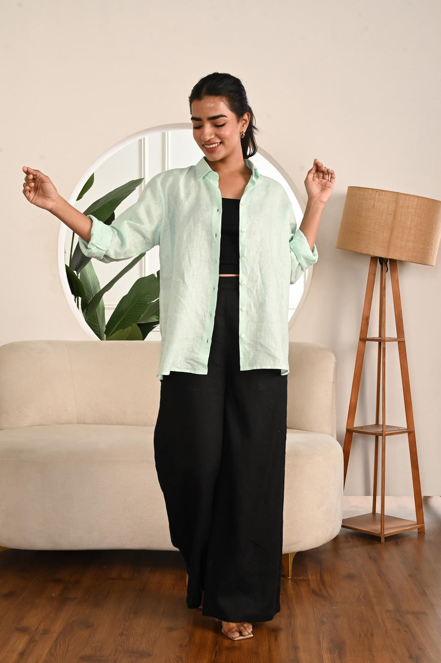 Oversized Pure Linen Button-Up Shirt: full length view of Mint Mist shirt with arms out and wide black trousers