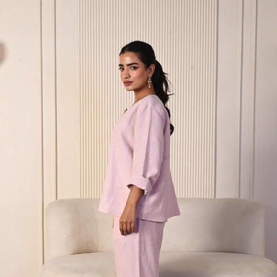 Pink Oversized Linen Button Shirt: side view of Light Pink oversized shirt and trousers