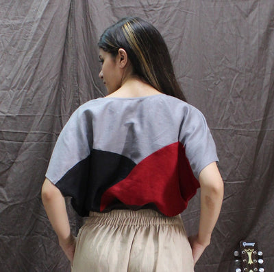 Plus Size Oversized Linen Boxy Top: back view of colourblock top with beige elastic waist trousers
