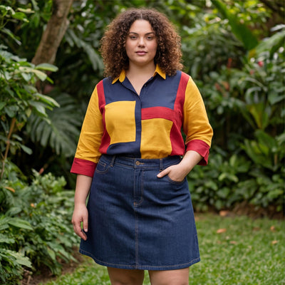 Red Blue Yellow Colorblock Linen Top: woman with curly hair in red, yellow and navy top and denim skirt