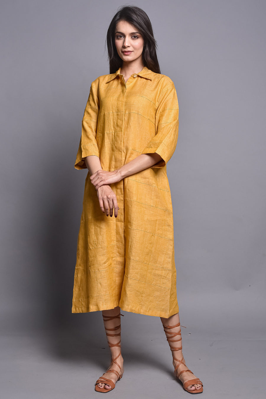 Relaxed Fit Linen Tunic Dress, Straight Collar: woman in mustard linen shirt dress, hands clasped, grey backdrop