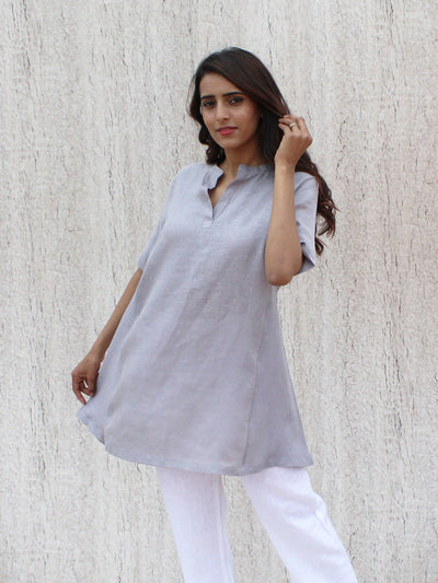 Ruffled Linen Tunic Top, Relaxed Fit: walking pose in Light Grey tunic top, hand near ear