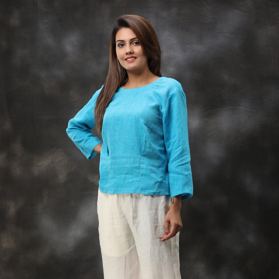 Sky Blue Linen Top, 3/4 Sleeve: woman in Turquoise Blue top, three-quarter sleeves, standing