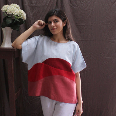 Sky Blue and Red Linen Top, Boxy Fit: woman in pale blue and red colorblock top, hand on head