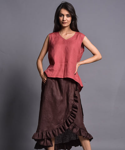 Sleeveless V-Neck Linen Top: full length view of coral red linen top with brown ruffle wrap skirt