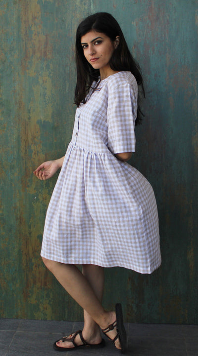 Smocked Linen Midi Dress, Short Sleeve: woman in gingham linen dress, looking back over shoulder, sandals