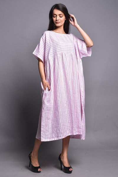 Striped Linen Midi Dress, Boxy Fit: woman in pink and white striped linen dress, hand raised to hair