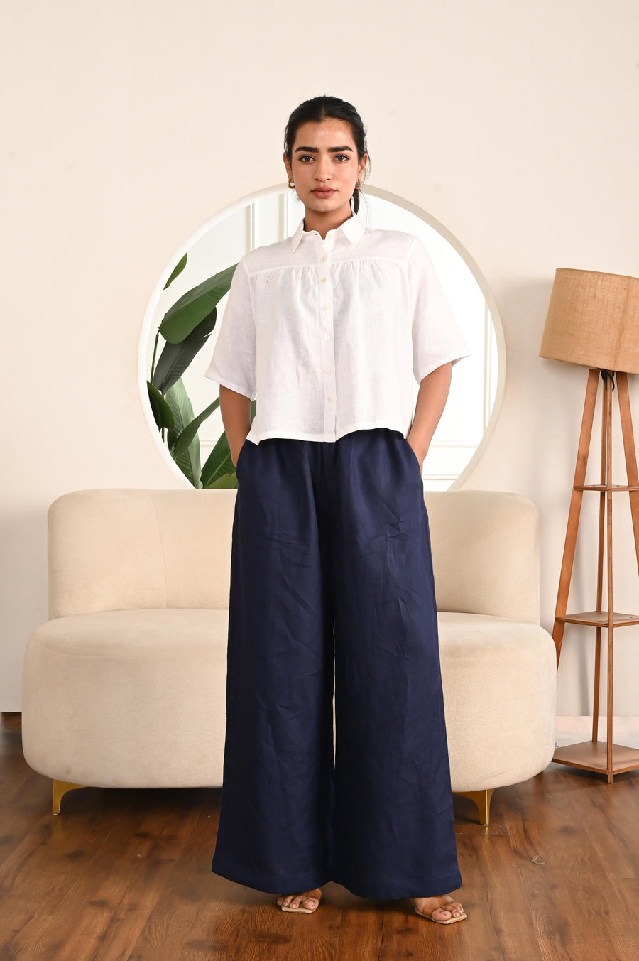 Wide Leg Linen Palazzo Pants, High Rise: close-up of Navy Blue palazzo pants and white shirt, hands at sides