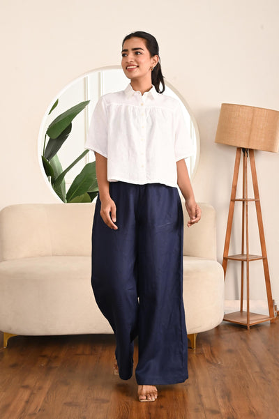 Wide Leg Linen Palazzo Pants, High Rise: woman in Navy Blue wide leg palazzo pants and white shirt, front view