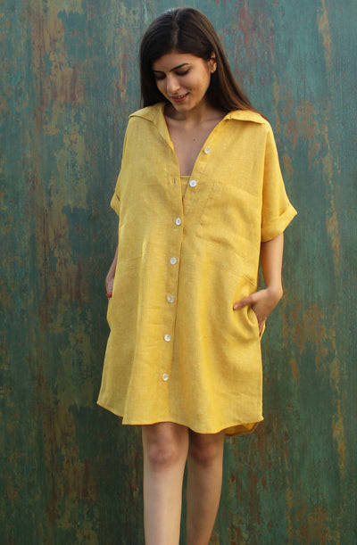 Yellow Linen Shirt Dress, Short Sleeve: woman in yellow linen shirt dress with V-neck collar, hands in pockets